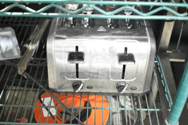 Hamilton Beach 24714G 4-slot countertop toaster in silver. Features control knobs and lever; used condition, 120V, 1 Phase.