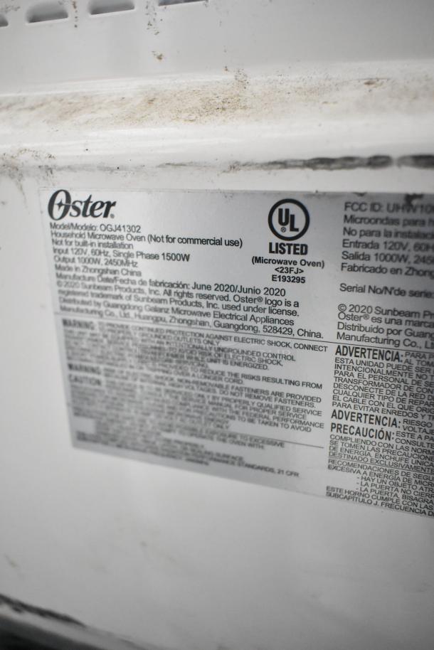 2020 Oster OGJ41302 countertop microwave oven label showing model, UL certification, 120V, single phase, made in China.