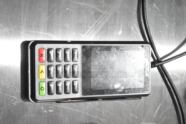 Verifone P400 credit card reader with visible wear, keypad, and touchscreen; one of seven items in this auction lot.