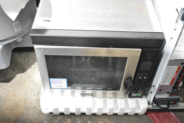 Brand new Amana RC30S2 commercial microwave, stainless steel, push-button controls, 208/240V, USA label, light scratches.