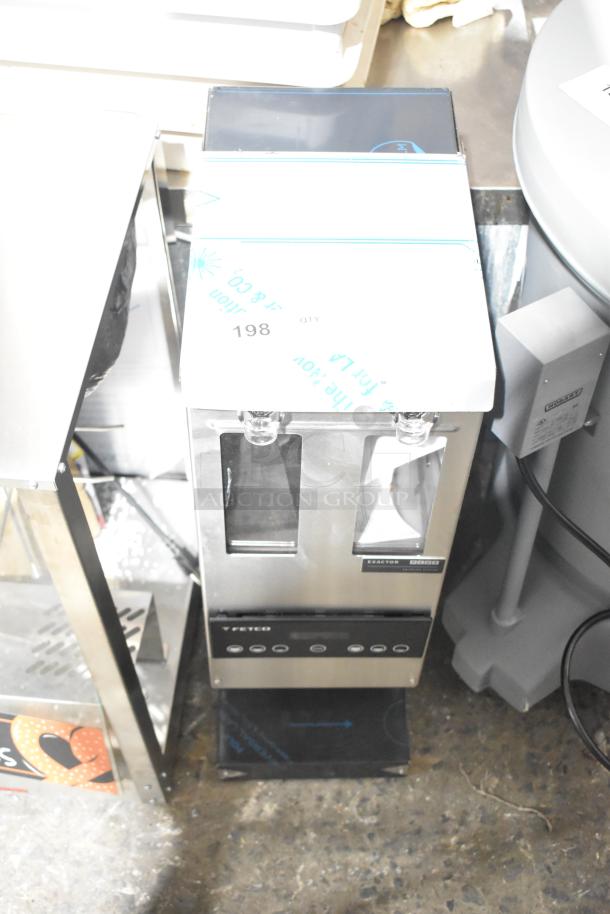 Brand new Fetco GRS-1202 10 lb. double hopper coffee grinder, 120 volts, showing minimal scratch and dent marks.