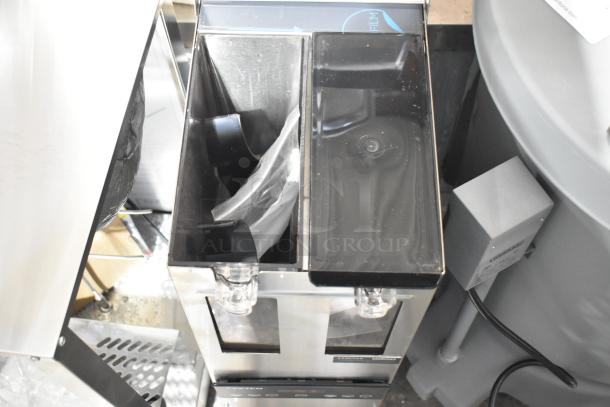 Brand new Fetco GRS-1202 coffee grinder with dual 10 lb. hoppers, minor scratches. Model 2025, 120V, 1 phase, clear hopper lids.