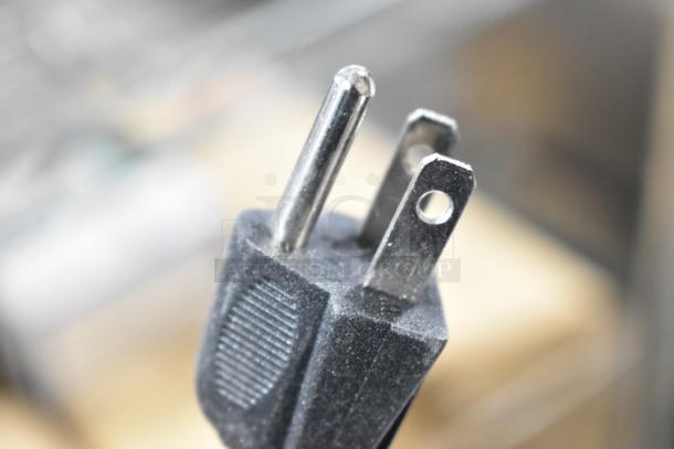 Close-up of a power plug for the Nemco 6403 Dual Rack Revolving Pretzel Warmer, 120 volts, 1 phase.