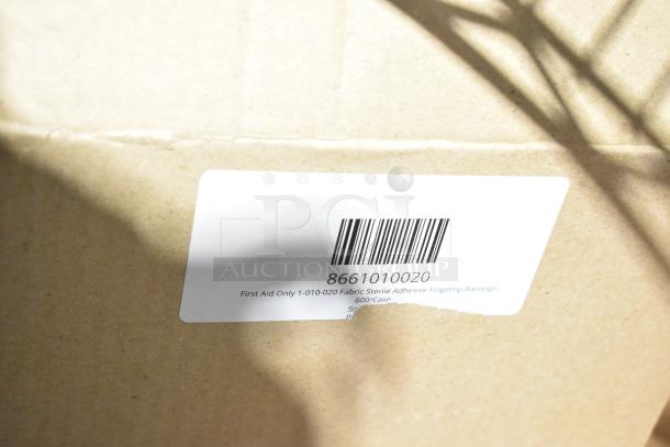 Cardboard box with a label showing barcode 8661010020, First Aid Only fabric sterile adhesive fingertip bandage, 600/case.