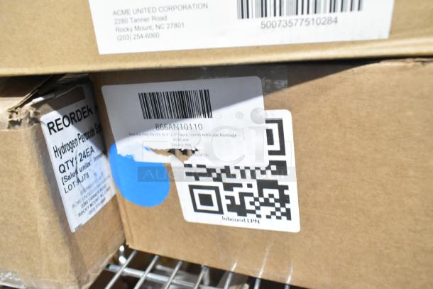 Nine boxes labeled with medical supplies including hydrogen peroxide, scratch and dent condition, ACME United Corporation.