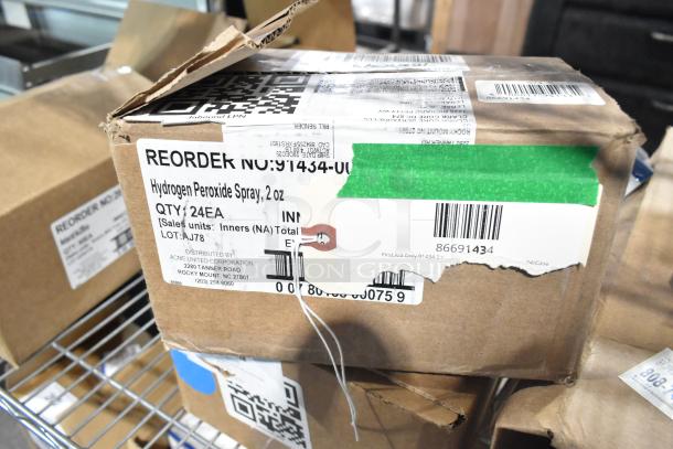Brown box labeled "Hydrogen Peroxide Spray, 2 oz," 24 units, by Acme United Corp. Scratch and dent condition.