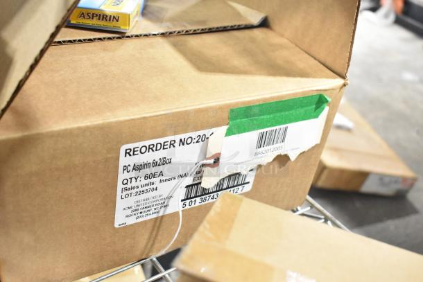 New scratch and dent box labeled “PC Aspirin 6x2/Box” with 60 units. Visible reorder number and barcode.