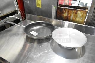 Vollrath Wear-Ever 14" Aluminum Fry Pan with CeramiGuard II coating, silicone handle, and Matfer Bourgeat 12" Cake Stand.