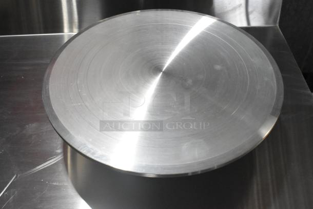 Matfer Bourgeat 421501 12" Revolving Cake Stand in new condition, metallic with a smooth circular top.