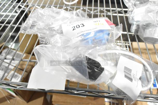 Four brand new scratch and dent items on a metal shelf, including a capacitor and inlet valve, in original packaging with labels.