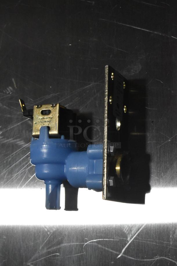 Brand new inlet valve with metal bracket, blue plastic body, and visible label indicating "SAVONI CE315." Scratch and dent condition.