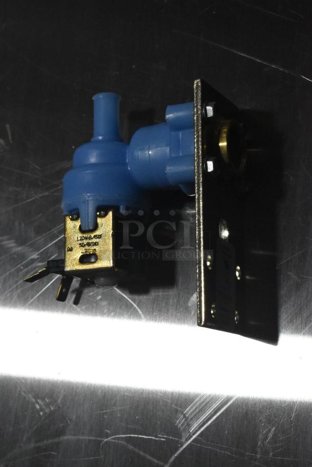 Brand new inlet valve with brass fittings, showing light surface marks. Voltage markings visible: 120V, 60Hz.
