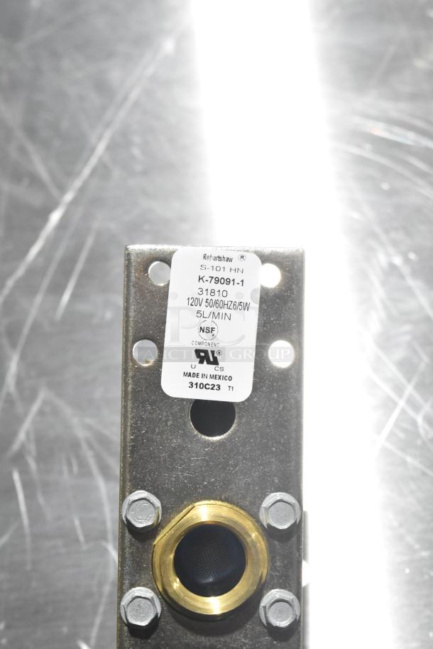 Valve with label showing "Robertshaw S-101 HN, K-79091-1, 120V, 5L/MIN, Made in Mexico, NSF certified," metal surface.
