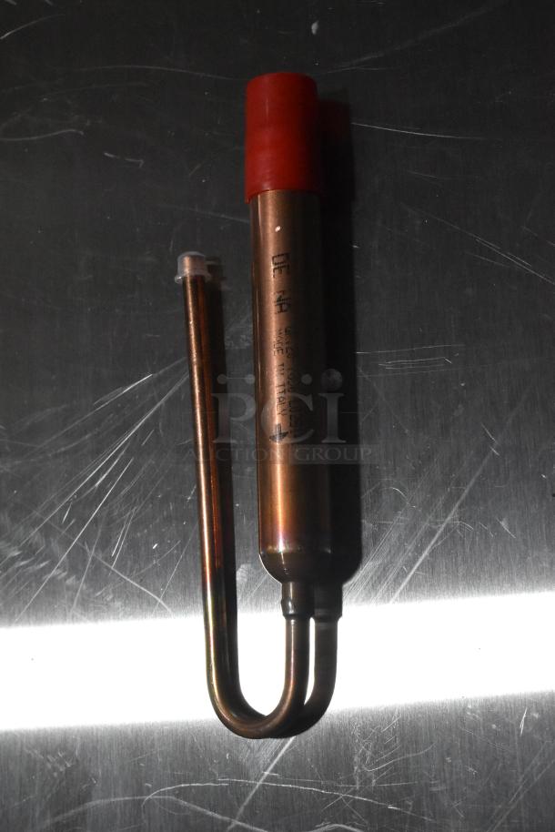 Copper probe with red cap, marked with text, on reflective surface. Brand new, part of scratch and dent lot.