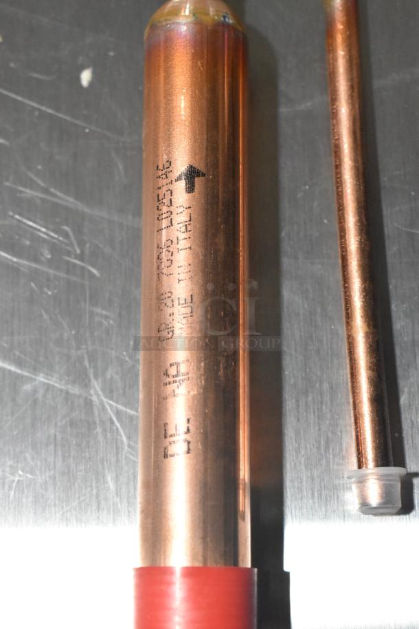 Copper probe with red tip, marked "Made in Italy," part of a scratch and dent auction set.