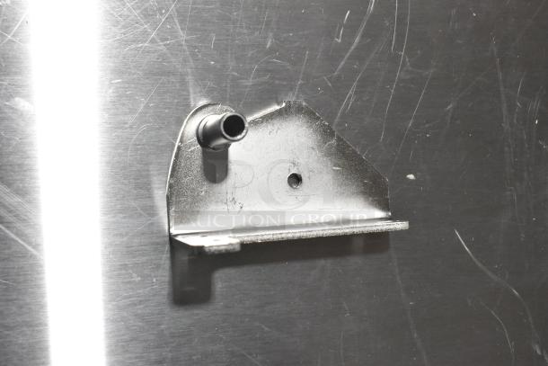 Metal hinge with a cylindrical attachment, brand new but with visible scratches and dents. Part of a 5-item auction.