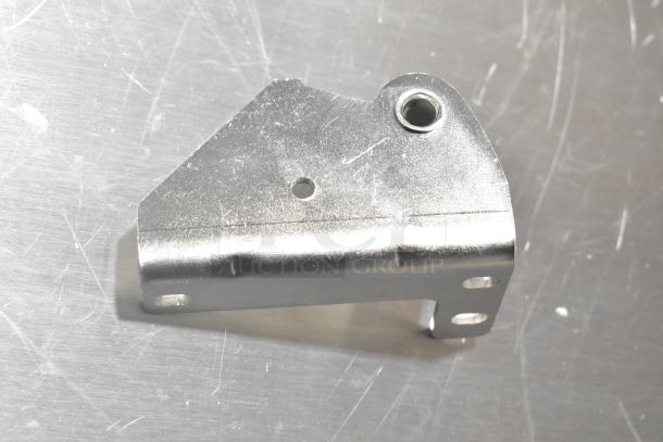 Metal hinge, brand new with minor scratches, featuring multiple mounting holes, shown on a reflective surface.