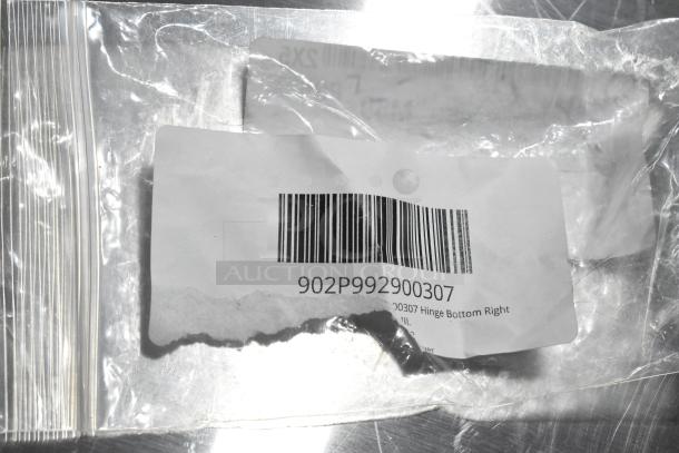 Clear plastic bag with barcode label, code 902P992900307. Contains hinge, probe, knob, and other items, possibly in new condition.