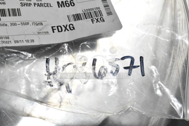 Plastic bag with shipping label and handwritten number HP366571, containing scratch and dent items including hinge, probe, knob.