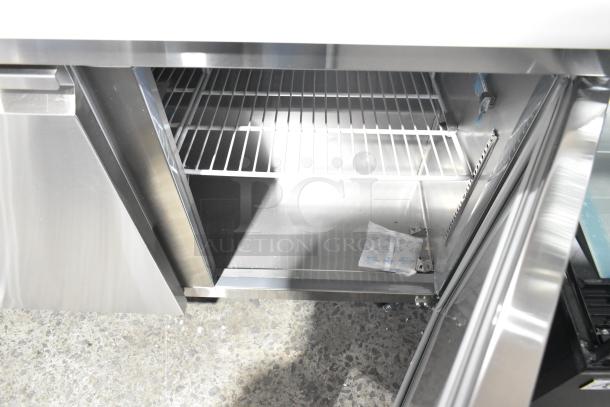 Brand new Avantco 178SSPT488 48" stainless steel refrigerated sandwich prep table, open doors, wire shelving inside, 115V.