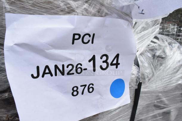 Shrink-wrapped bundle with label "PCI JAN26-134 876" indicating auction lot of scratch and dent items including bar stools.