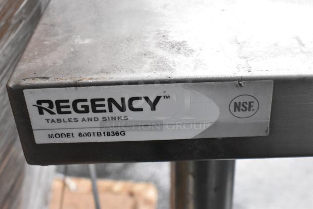 Regency 600TB1838G stainless steel table, NSF certified, with backsplash and undershelf, visible label and model info.