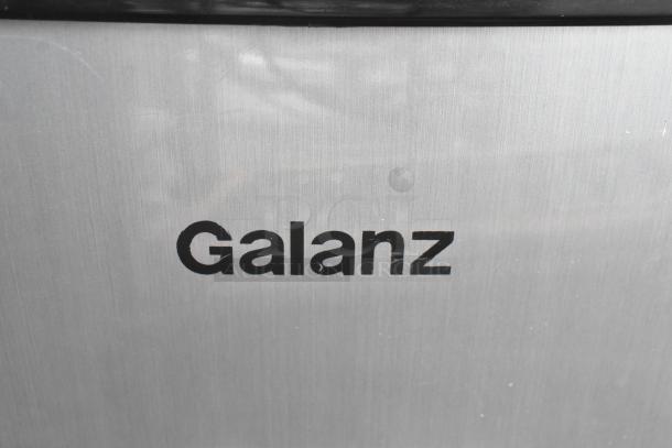 Alt text: "Close-up of Galanz mini cooler with brushed metal finish. Part of an auction for three mini coolers including Hisense, 120 volts, 1 phase."