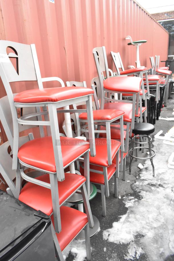46 metal dining chairs with red seat cushions and green stools, in fair condition. Auction offers 46 times your bid.