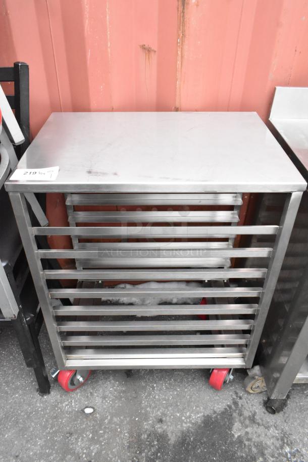 Brand new Regency 600PR16248WS sheet pan rack, 8 pan capacity, end load, with heavy-duty red casters, minor scratches.
