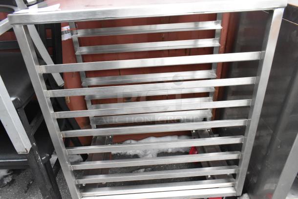 BRAND NEW SCRATCH AND DENT Regency 600PR16248WS sheet pan rack, holds 8 half-size pans, with heavy-duty casters.