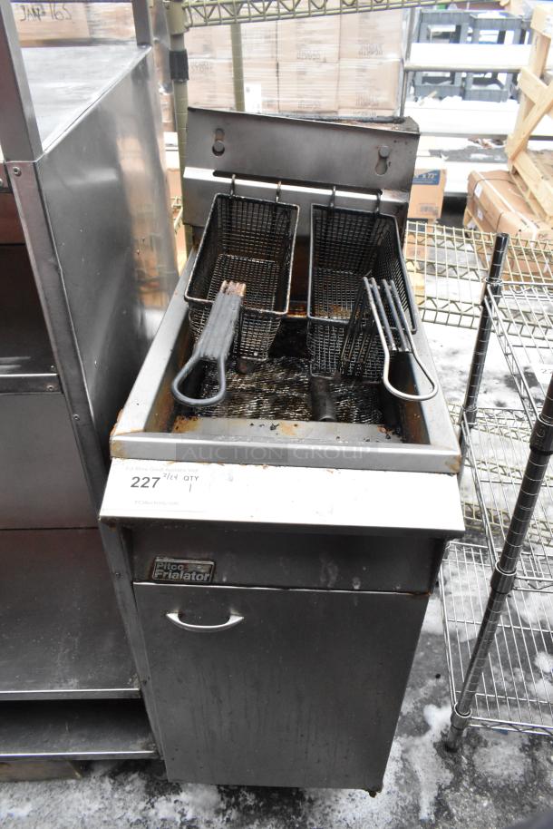 Pitco Frialator gas fryer with 2 metal baskets, used condition. Features stainless steel body, visible brand logo, and control panel.