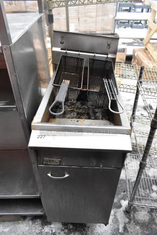 Pitco Frialator gas fryer with 2 metal baskets, used condition. Features stainless steel body, visible brand logo, and control panel.