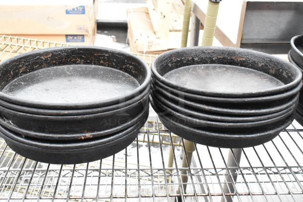 Chrome finish 3-tier wire shelving unit, supporting stacked black pans. Buyer must dismantle; freight charges apply.