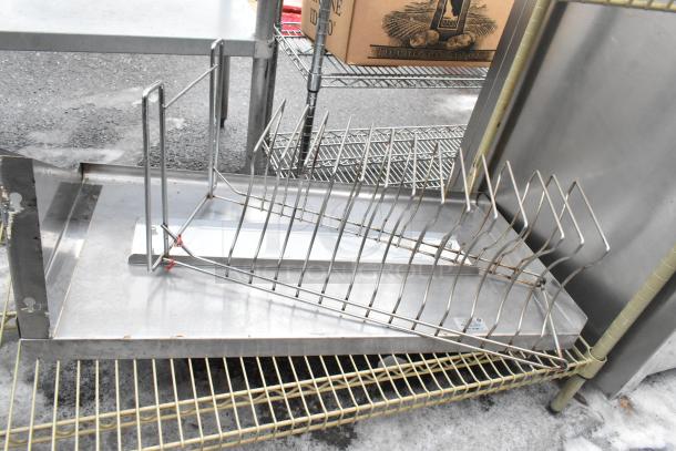 Three-tier wire shelving unit with contents, undismantled. Buyer responsible for dismantling and shipping arrangements.