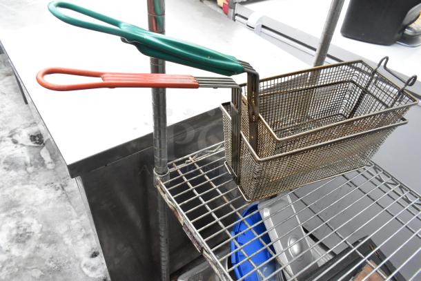 Chrome 4-tier wire shelving unit with contents, including metal baskets and cutting boards. Buyer must dismantle.