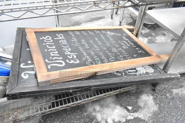 Chrome finish 4-tier wire shelving unit holding bowls, bins, and signs. Buyer must dismantle. Freight charges apply.