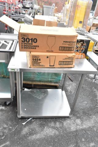 Regency 600TSB3036S stainless steel table with boxes labeled Libbey 3010 and 1454, containing glasses and bowls.