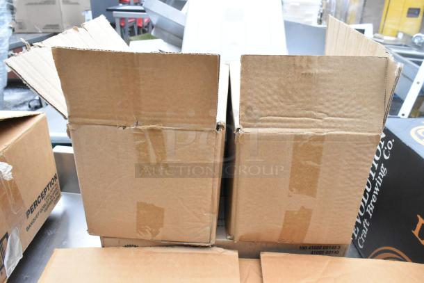 Regency 600TSB3036S table with boxes containing glasses and bowls. Boxes show shipping labels and markings.