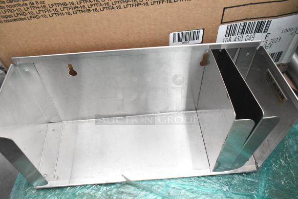 Stainless steel shelf with wall mount slots, part of a mixed pallet lot. Clean condition, includes packaging with barcodes.