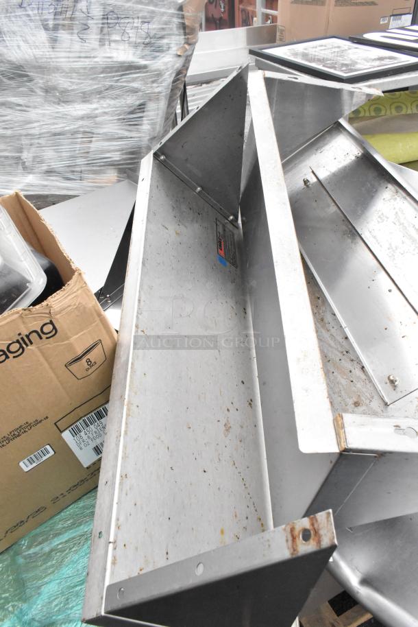 Pallet lot with metal shelves, poly drop-in bins, bowls, and table base posts. Items show visible wear and rust. Labels visible.