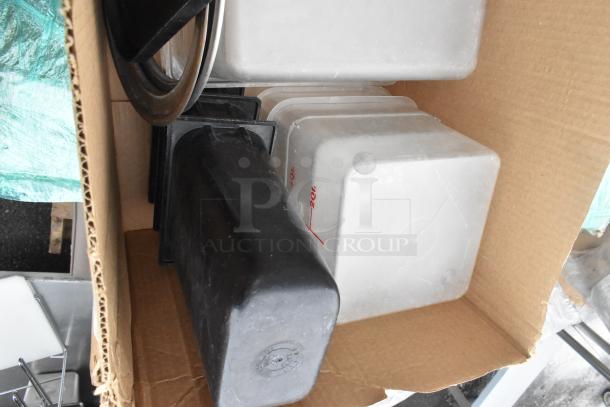 Pallet lot containing shelves, poly drop-in bins, bowls, and table base posts in a cardboard box. Items appear used.