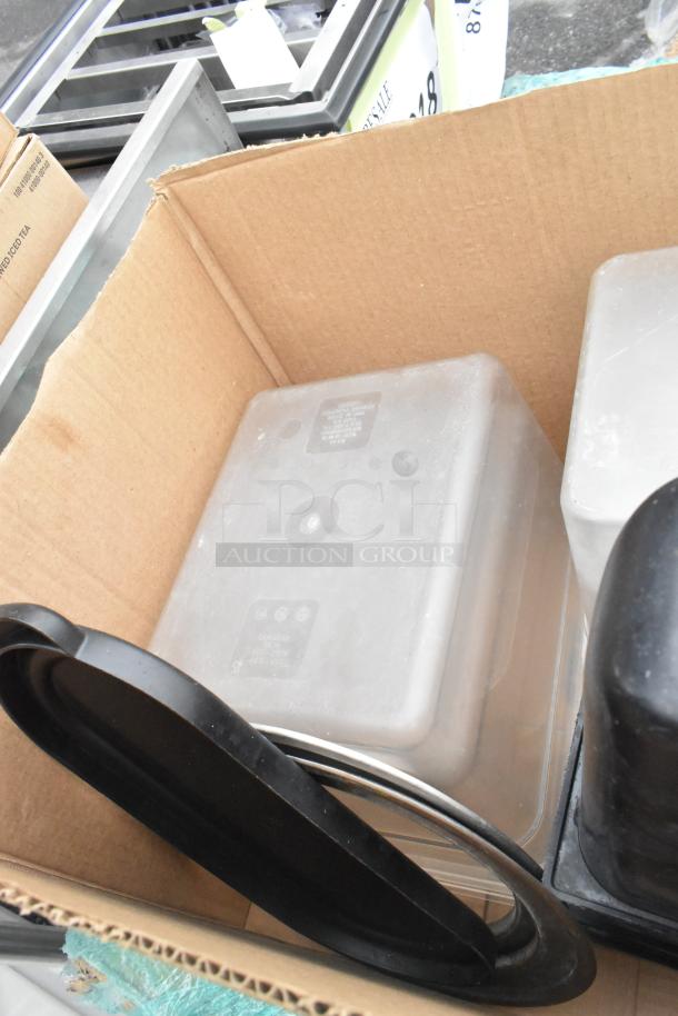 Pallet of assorted items: clear poly bins, metal shelves, black table base posts, bowls. Items in fair condition.