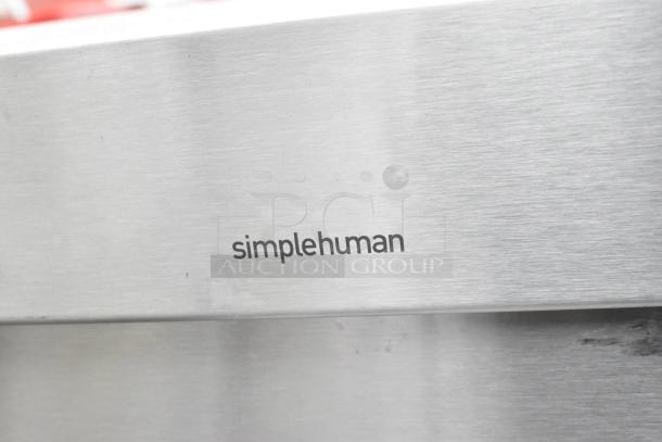 Simplehuman logo on a chrome-finish trash can, part of a set with a black poly can. Auction offers 2 times your bid.
