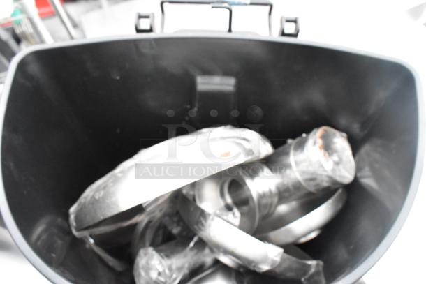 Two trash cans: one black poly and one chrome finish. Each in good condition. Auction includes double quantity.