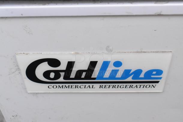 Coldline Chest Freezer, 115 volts, 1 phase. Logo and label visible on front. White exterior, commercial grade.