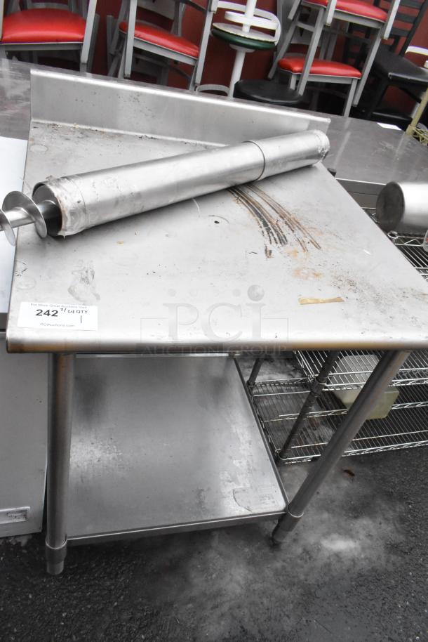 Stainless steel table with back splash, under shelf, used condition, some surface marks, auction tag "242".