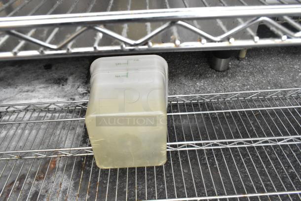 Chrome finish 3-tier wire shelving unit with fry baskets and cylindrical bins. Good condition, buyer must dismantle.