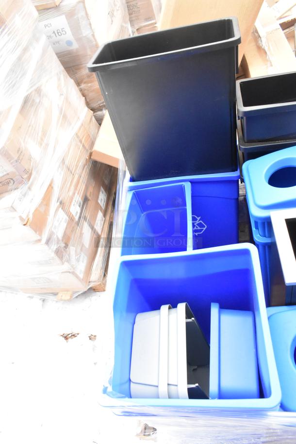 Six new black and blue slim line trash cans with minor scratches, stacked and ready for auction.