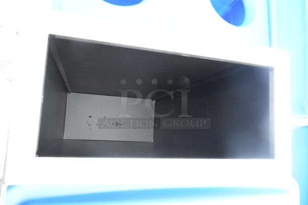 Six brand new slim line trash cans with minor scratches and dents. Bin interior view, showcasing sturdy construction.