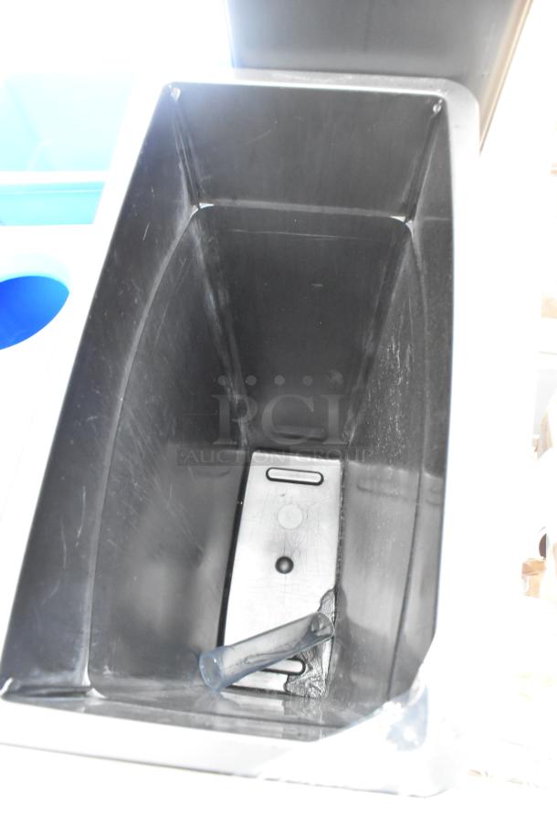 Brand new slim line trash can with minor scratches and dents. Durable black plastic, lid included. Auction for six cans.